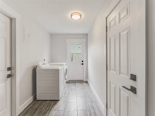 a view of hallway with wooden floor
