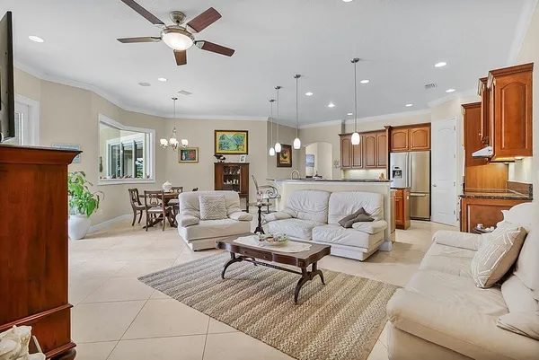a living room with furniture and a chandelier