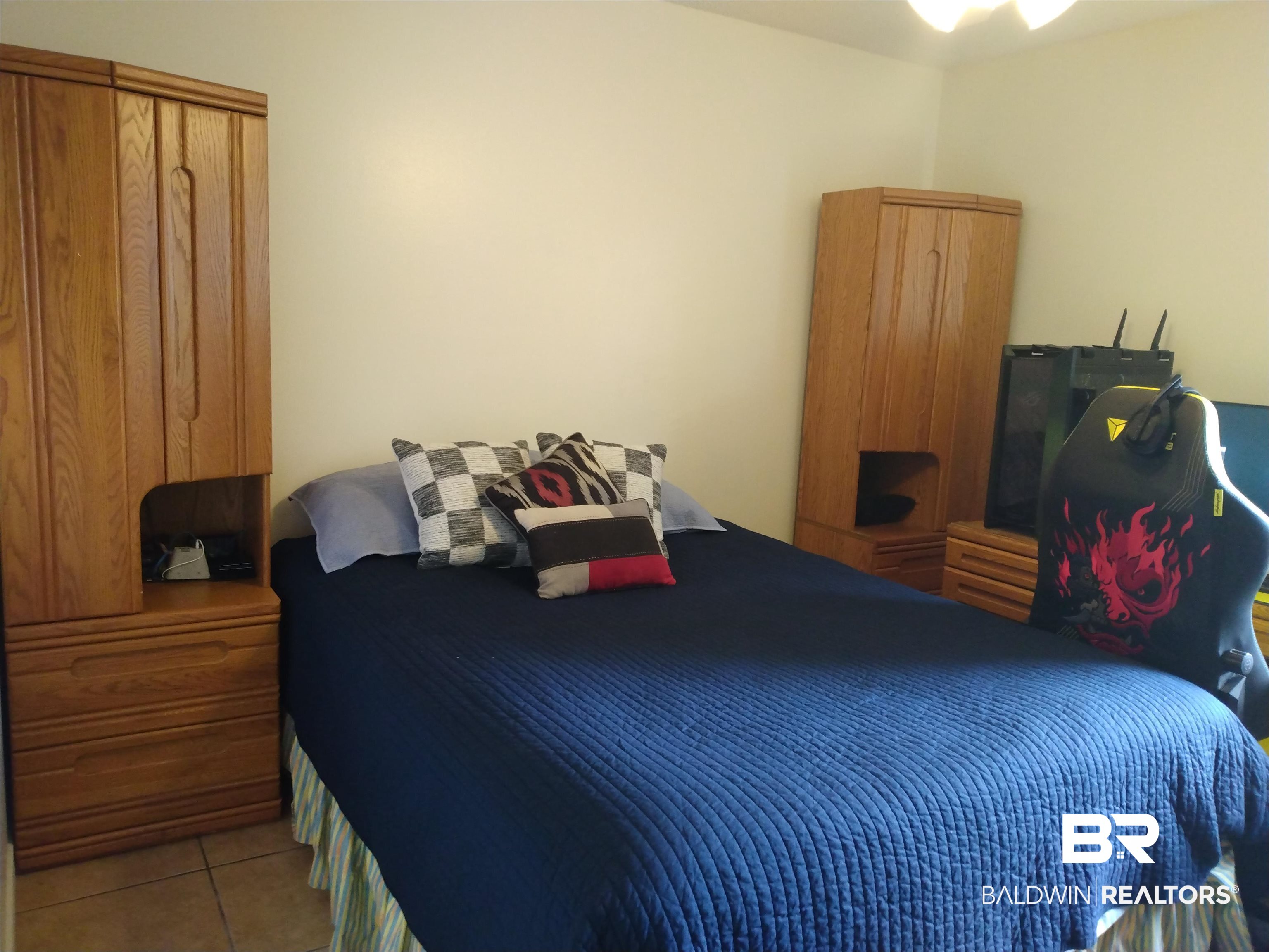 431 Hamilton Boulevard Foley, AL 36535 - Photo 17 of 30 Guest bedroom with light tile patterned flooring.