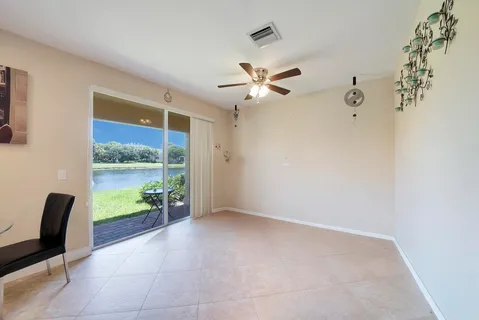 a view of room with window and ceiling fan