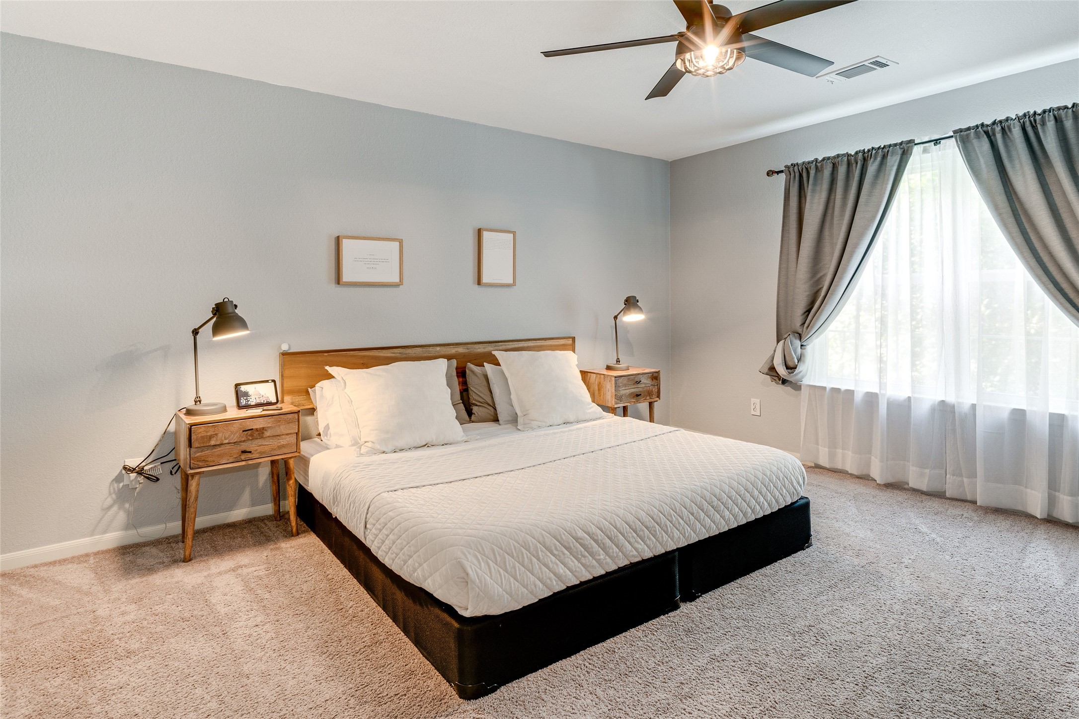 34 Steep Trail Place Conroe, TX 77385 - Photo 11 of 21 a bedroom with a bed and window