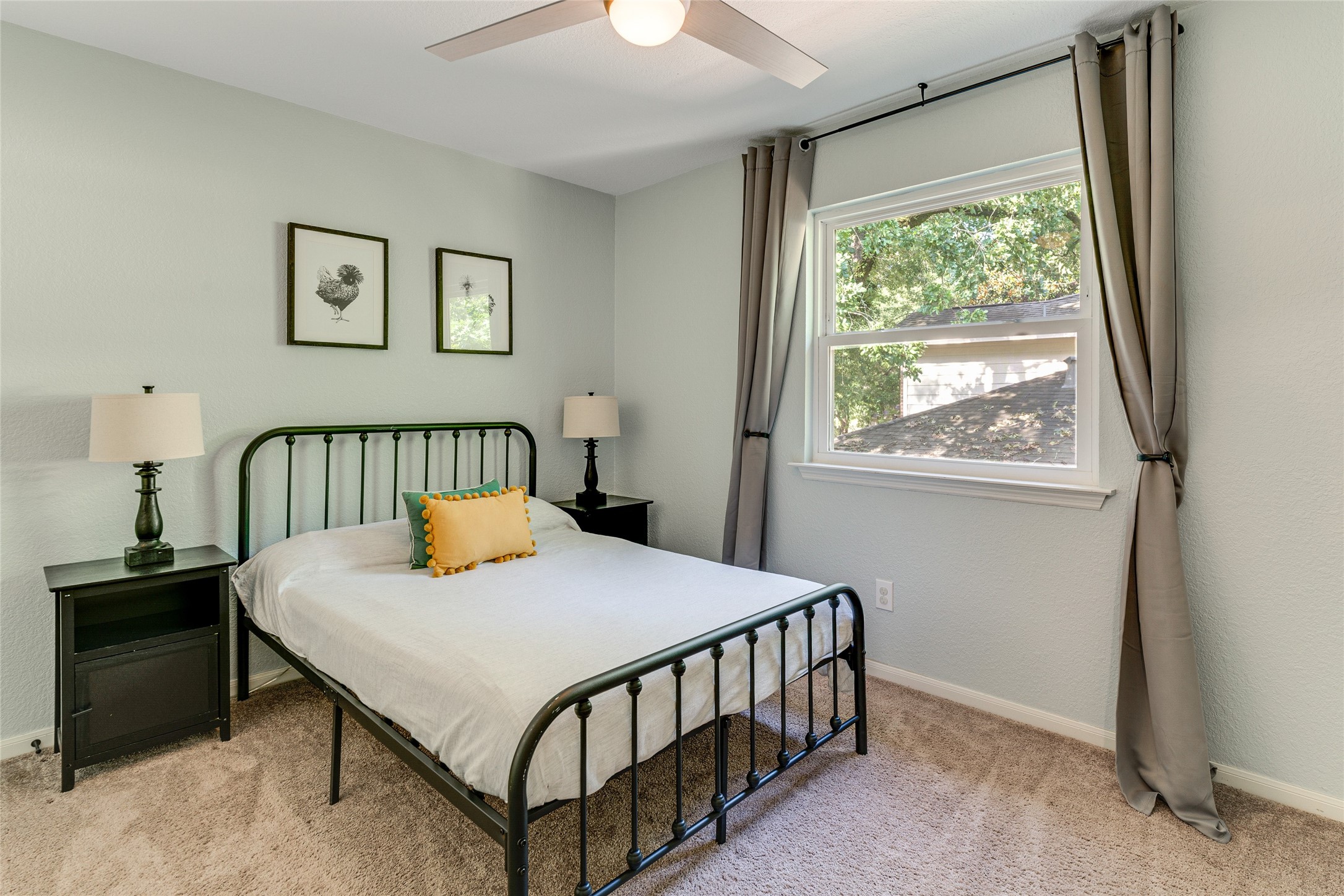 34 Steep Trail Place Conroe, TX 77385 - Photo 16 of 21 a bedroom with a bed and a window
