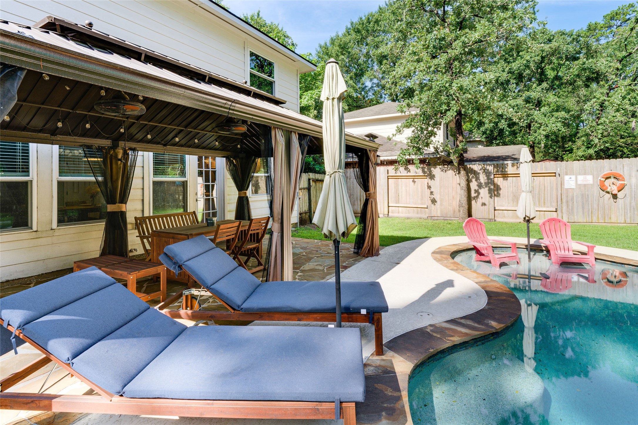 34 Steep Trail Place Conroe, TX 77385 - Photo 19 of 21 a view of a backyard with a patio
