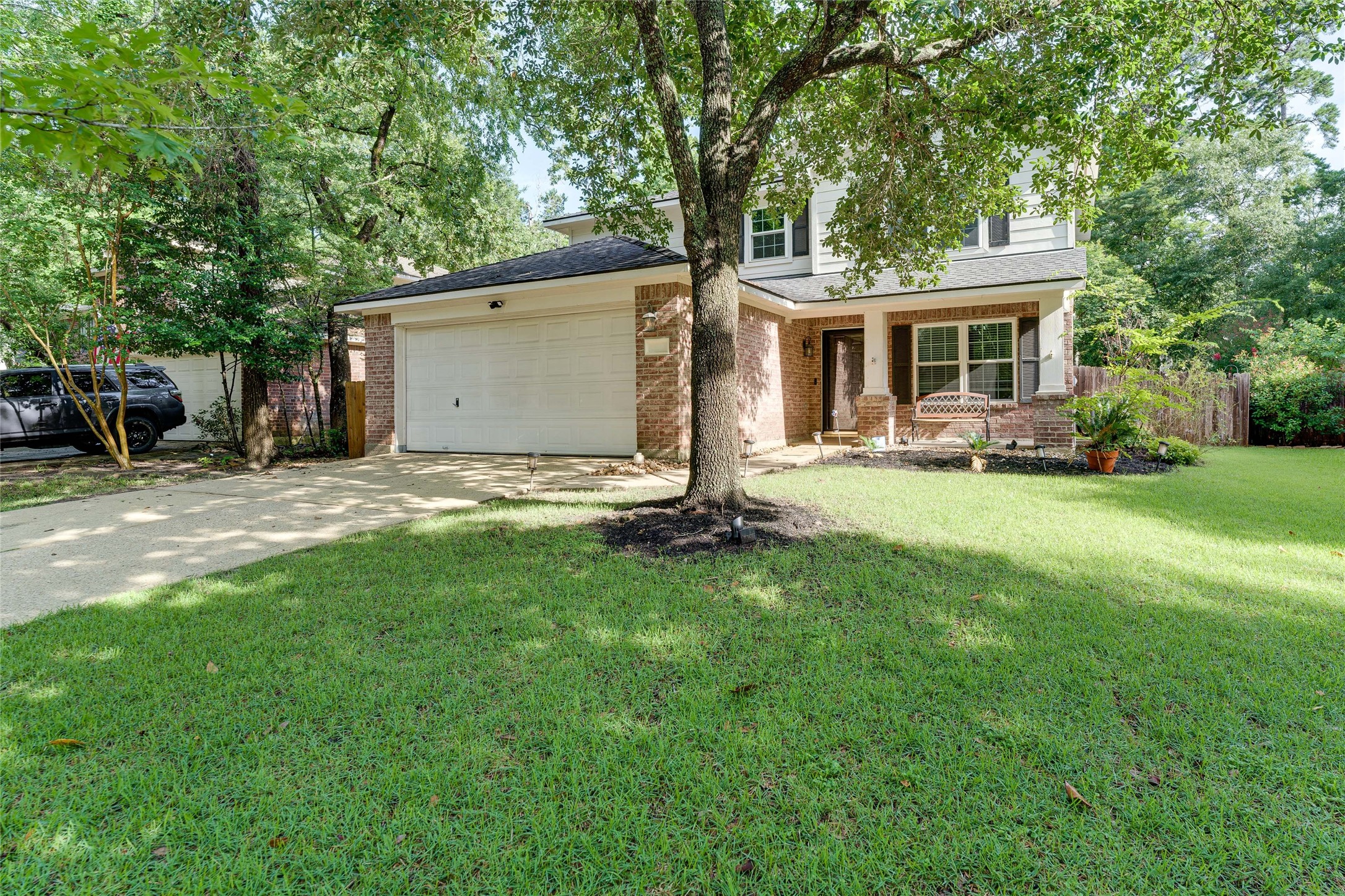 34 Steep Trail Place Conroe, TX 77385 - Photo 2 of 21 a front view of house with yard and green space