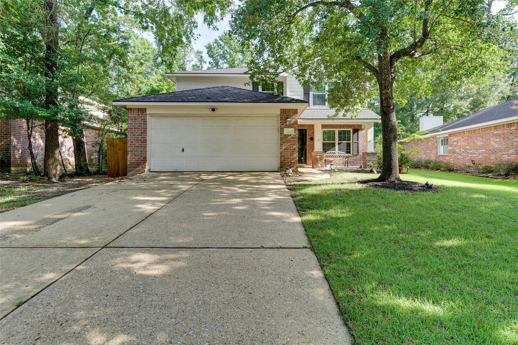 34 Steep Trail Place Conroe, TX 77385 - Photo 21 of 21 a front view of house with yard and trees