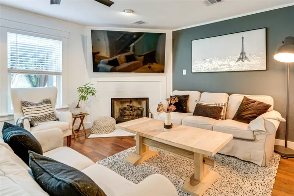 a living room with furniture and a fireplace