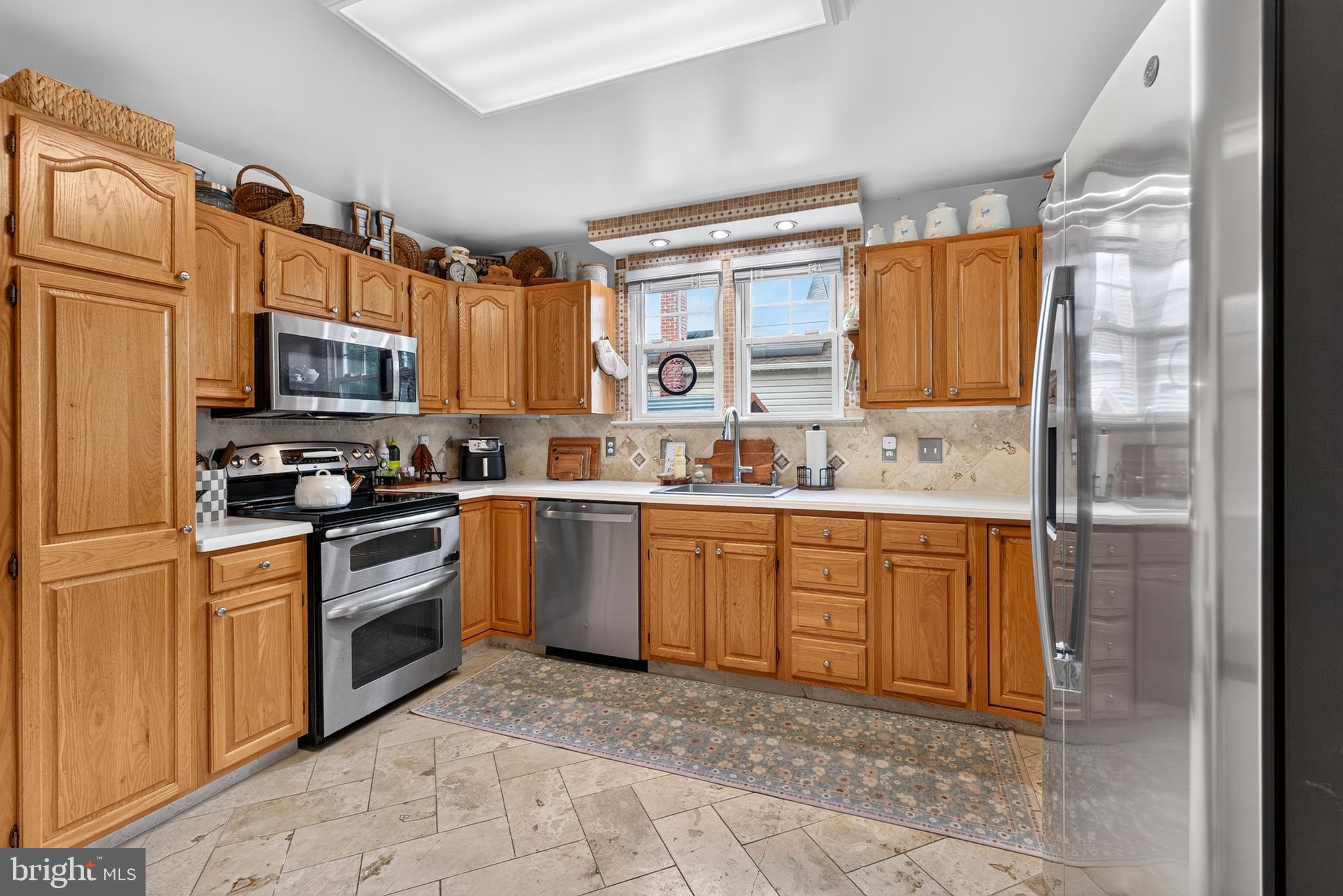 7415 Greenbank Road Middle River, MD 21220 - Photo 13 of 44 Quartz countertops and stainless steel appliances