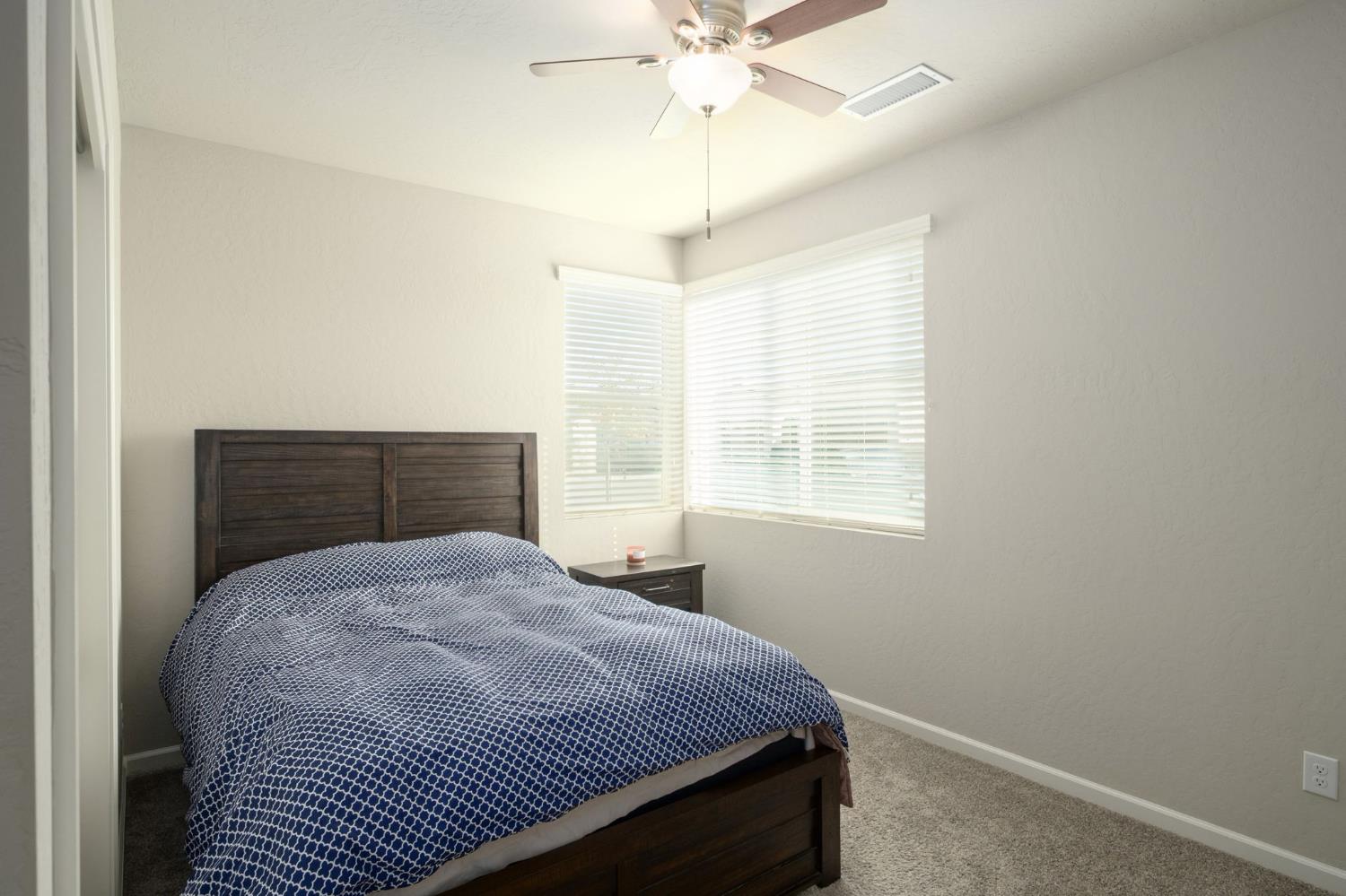 502 Traverse Drive South Madera, CA 93636 - Photo 19 of 40 a bedroom with a bed and window