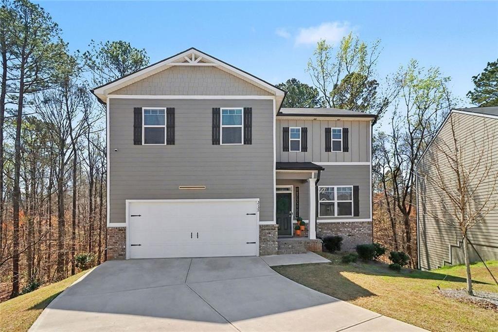 3732 Chevington Court Southeast Atlanta, GA 30354 - Photo 1 of 38 a front view of a house with a yard and garage