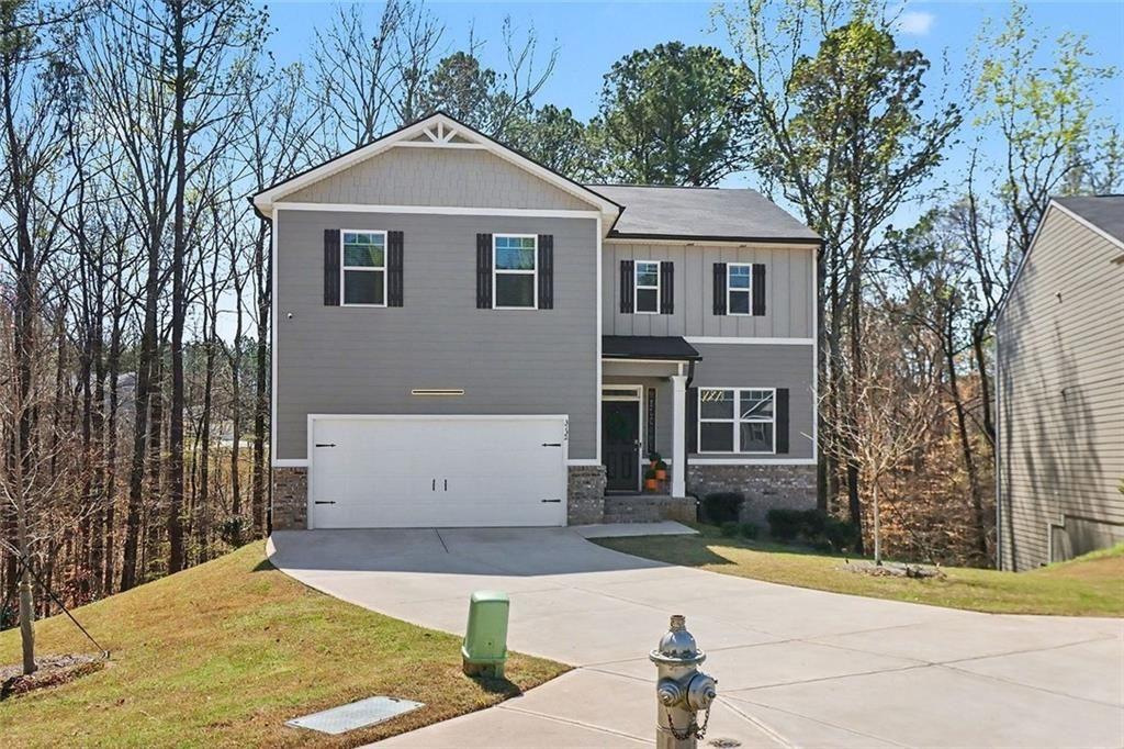 3732 Chevington Court Southeast Atlanta, GA 30354 - Photo 2 of 38 a front view of a house with a yard