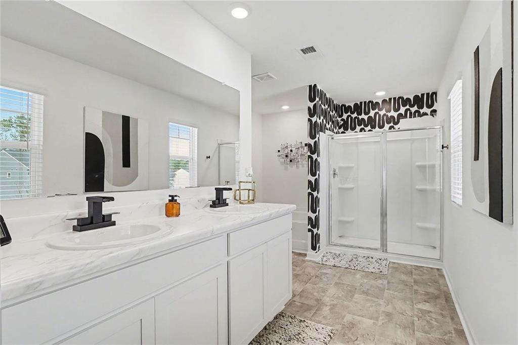 3732 Chevington Court Southeast Atlanta, GA 30354 - Photo 26 of 38 a bathroom with a double vanity sink mirror and shower