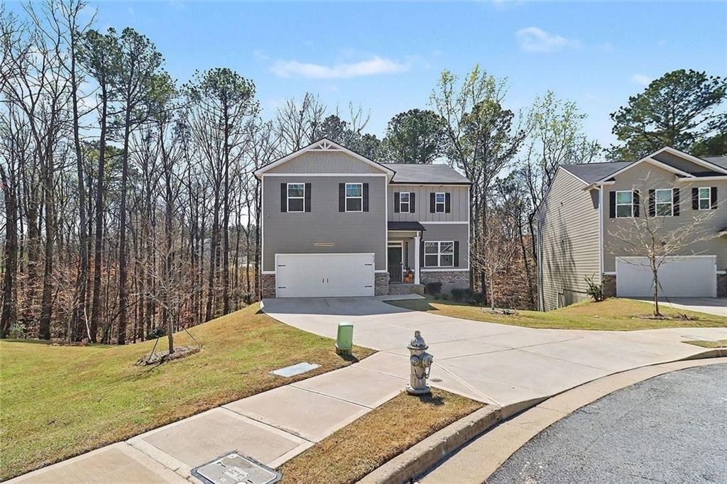 3732 Chevington Court Southeast Atlanta, GA 30354 - Photo 3 of 38 a front view of a house with a yard