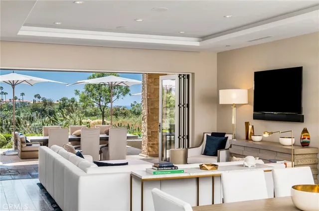 a living room with fireplace furniture and a flat screen tv