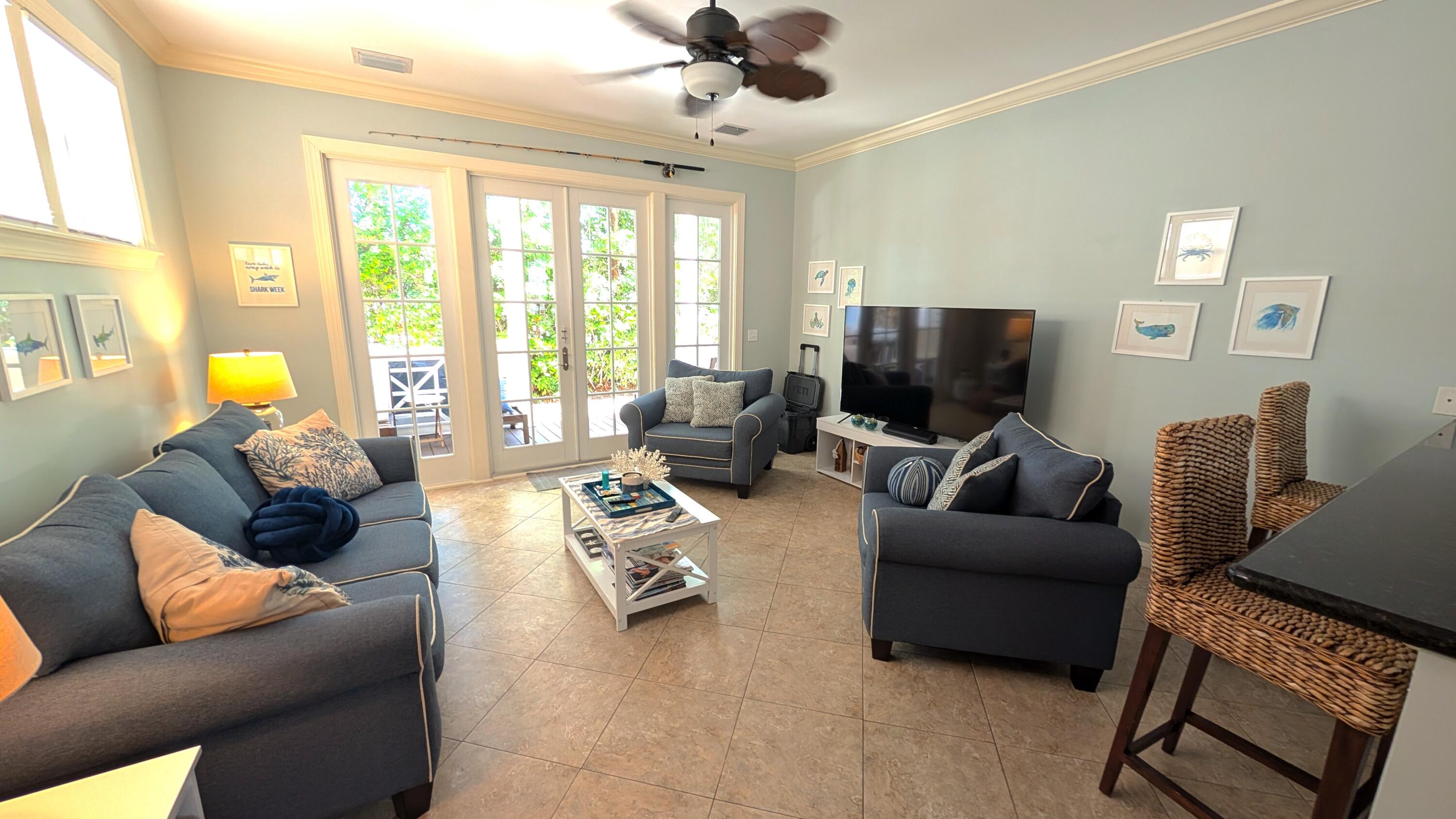 104 Anglers Way Islamorada, FL 33036 - Photo 11 of 18 a living room with furniture and a flat screen tv