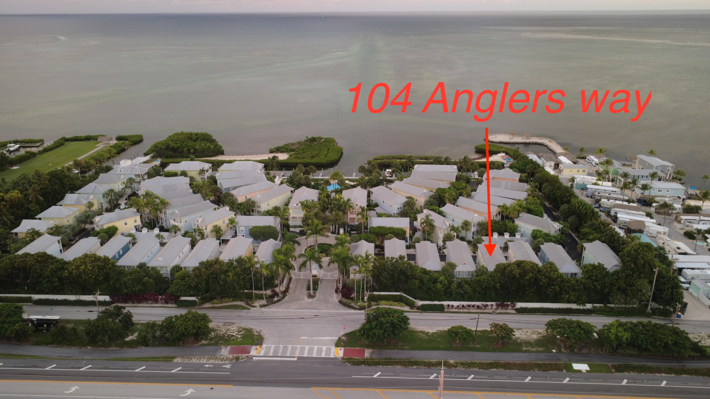 104 Anglers Way Islamorada, FL 33036 - Photo 6 of 18 an outdoor space with lots of plants and seating space