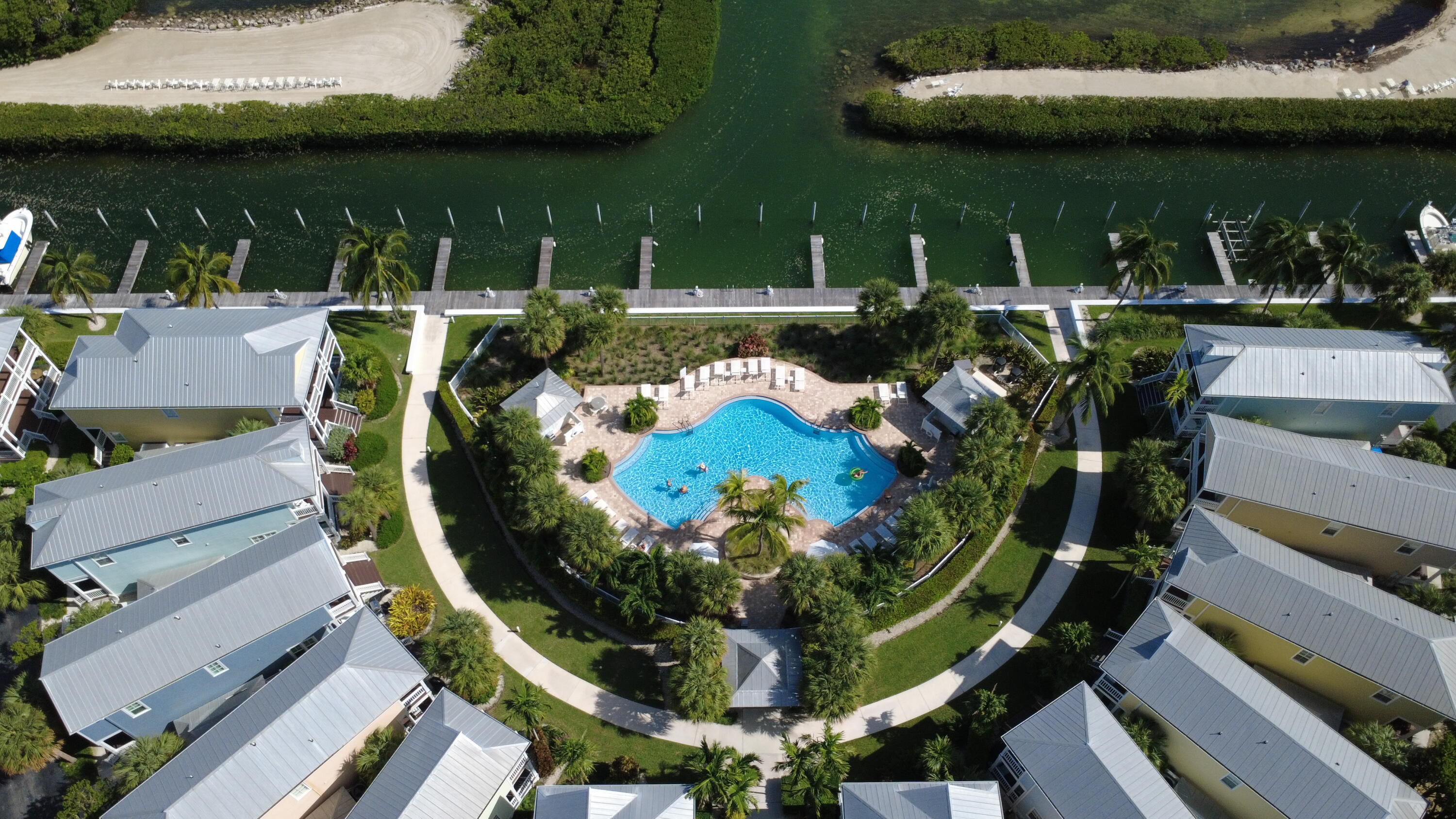 104 Anglers Way Islamorada, FL 33036 - Photo 8 of 18 a view of a swimming pool with outdoor seating and plants