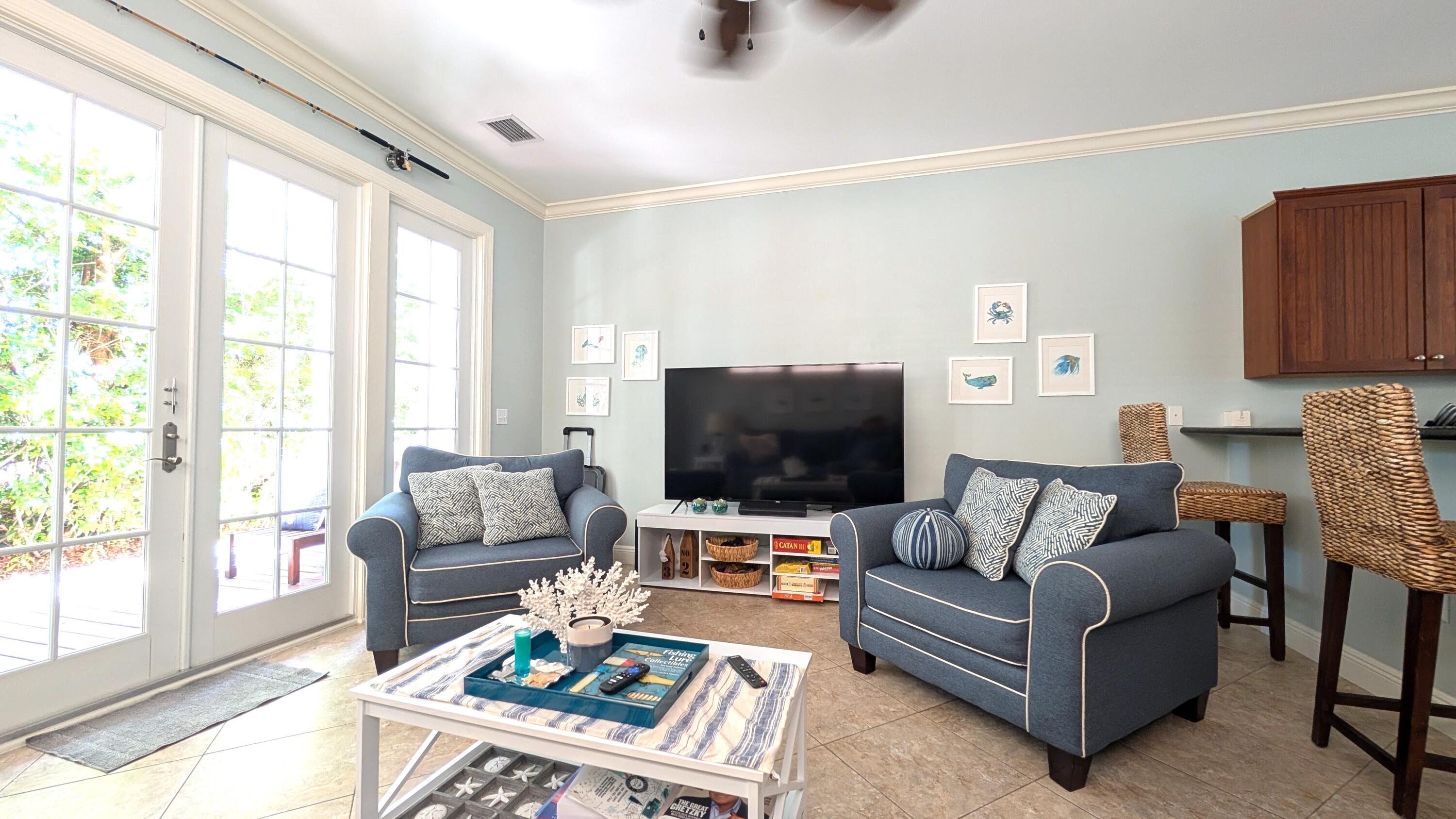 104 Anglers Way Islamorada, FL 33036 - Photo 10 of 18 a living room with furniture and a flat screen tv