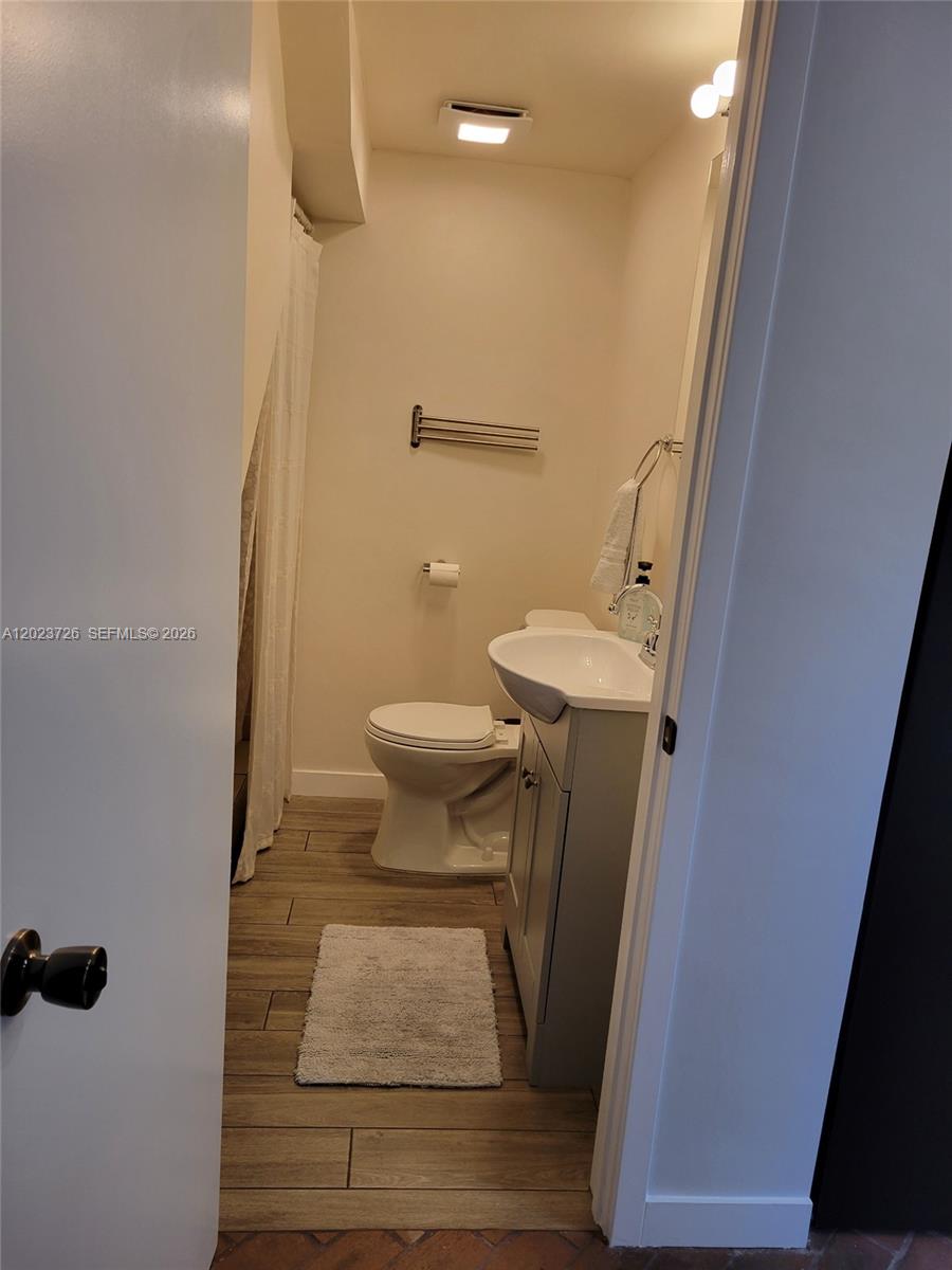 5866 Southwest 60th Street, Unit 3 Miami, FL 33143 - Photo 5 of 8 a bathroom with a sink and toilet