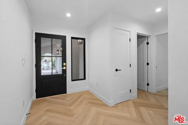 a bedroom with a bed and a closet