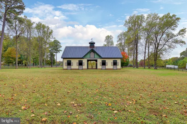 a kitchen with wooden cabinets and center island