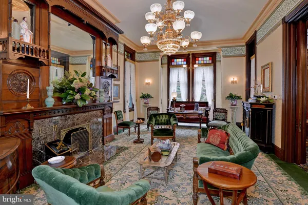 a kitchen with a stove and a wooden floor