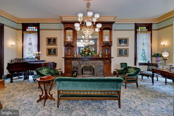 a dining room with furniture and a window