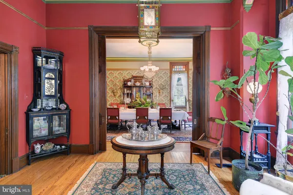 a room with a large window and furniture