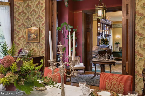 a view of living room with furniture and wooden floor