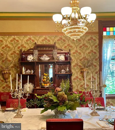 a bathroom with a sink toilet and a mirror