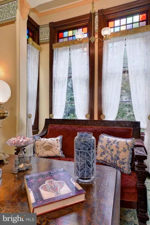 a view of a porch with furniture and a yard