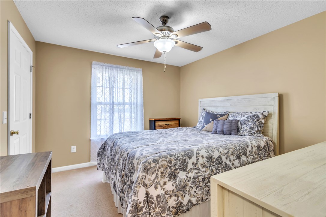 706 Pelham Square Way Greer, SC 29650 - Photo 13 of 20 This cozy bedroom offers a tranquil retreat with soft lighting and comfortable carpeting.