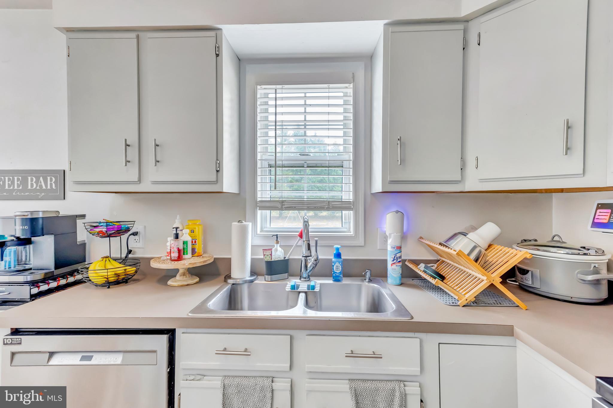 4925 Campground Road Eden, MD 21822 - Photo 10 of 42 a kitchen with stainless steel appliances granite countertop a sink a stove and cabinets
