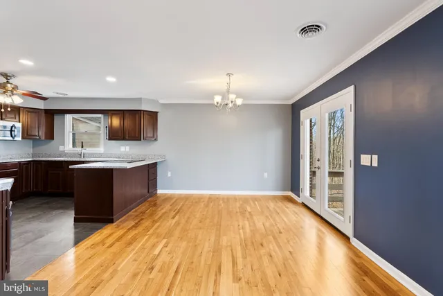 a kitchen with a refrigerator and a sink