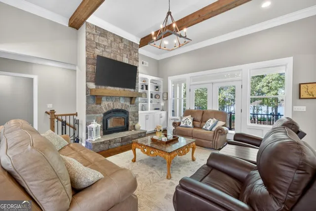 a kitchen with kitchen island a stove a table and chairs
