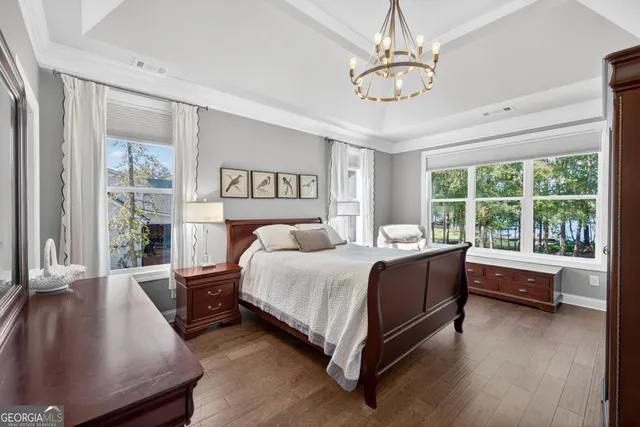 a bedroom with a bed a desk and chair