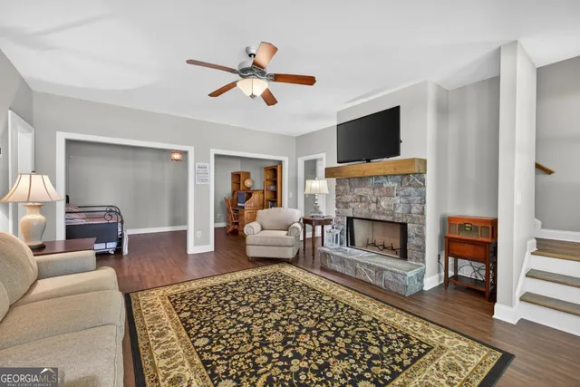 a outdoor living space with furniture and a ceiling fan