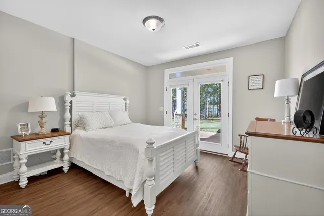 a view of a porch with wooden floor and fence