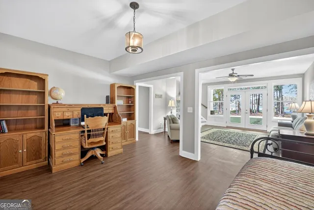 an aerial view of a house with a yard and lake view