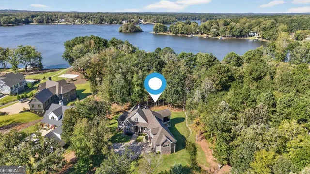 a living room with furniture ceiling fan and a rug