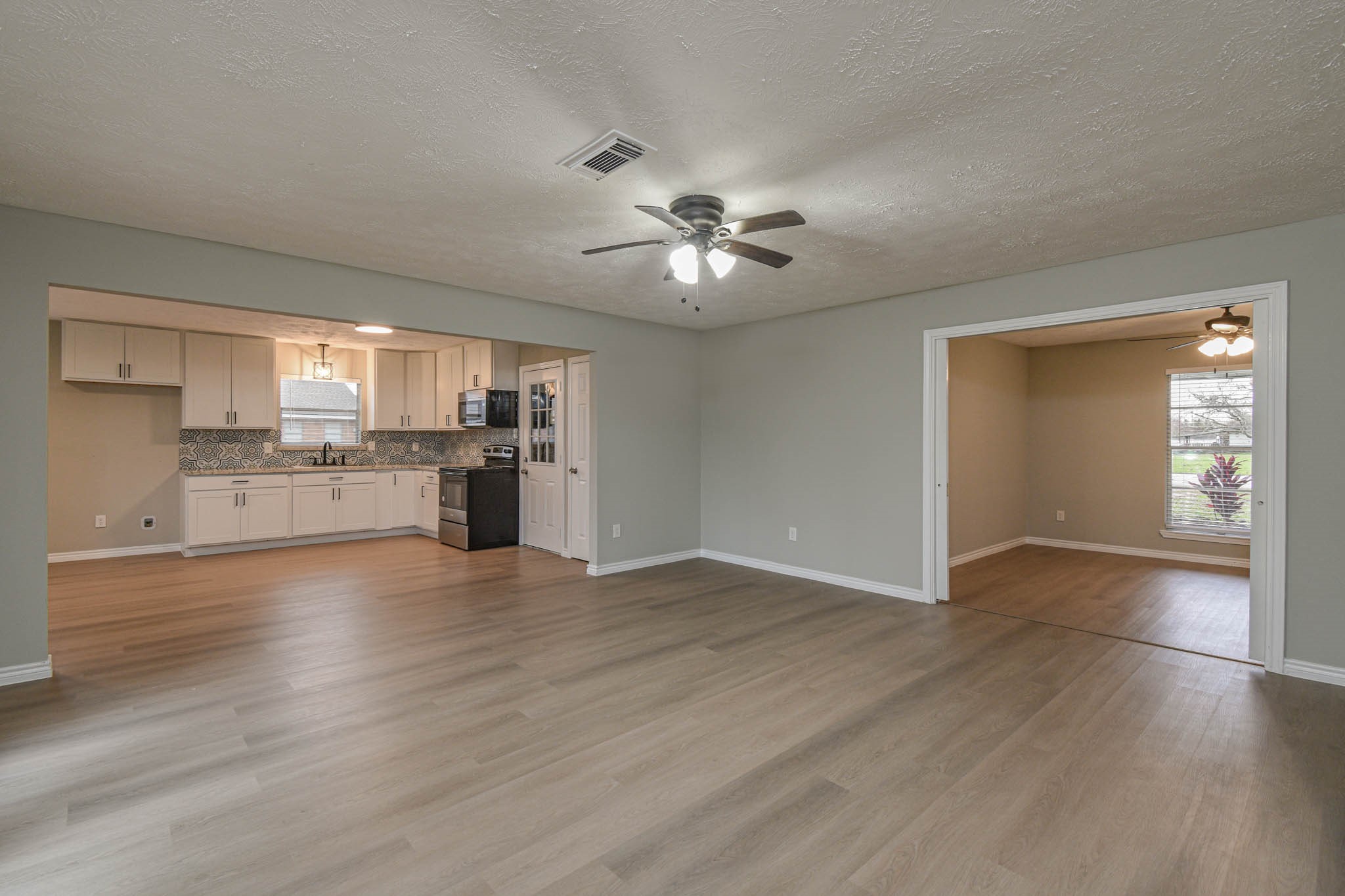 2834 Pansy Street Pasadena, TX 77503 - Photo 33 of 35 a view of kitchen with granite countertop cabinets and refrigerator