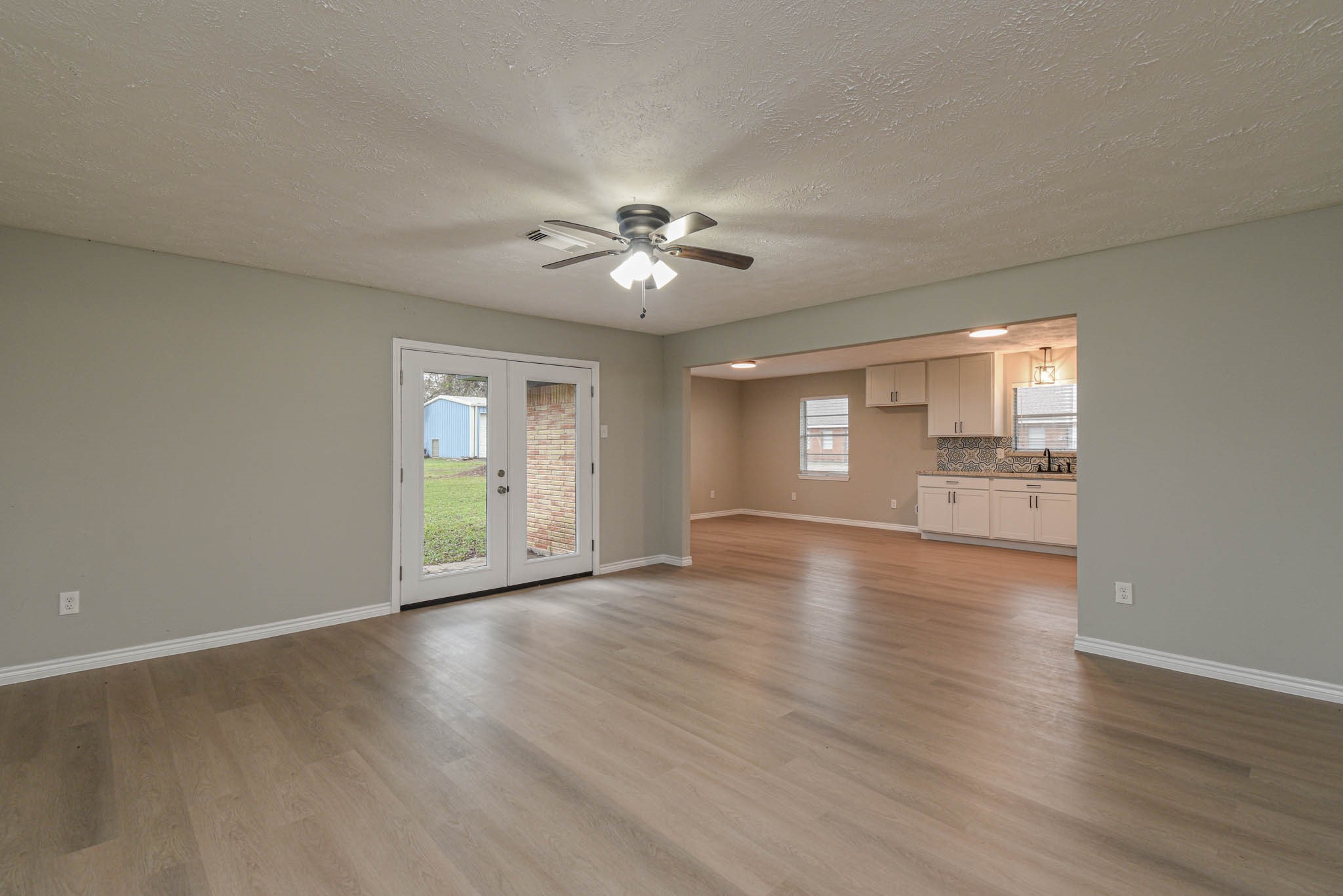 2834 Pansy Street Pasadena, TX 77503 - Photo 34 of 35 a view of an empty room with a window and wooden floor