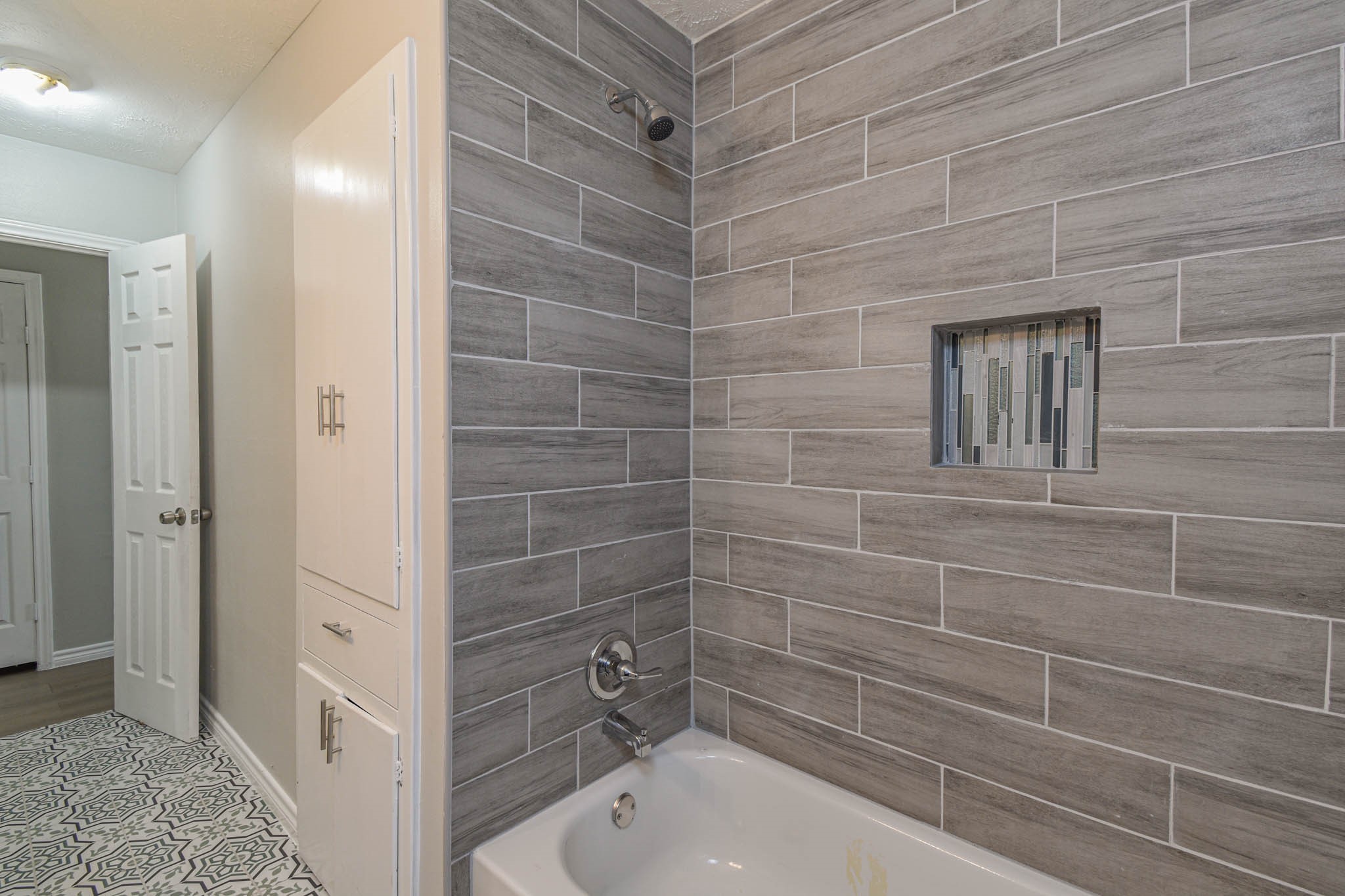 2834 Pansy Street Pasadena, TX 77503 - Photo 24 of 35 a bathroom with a tub and shower