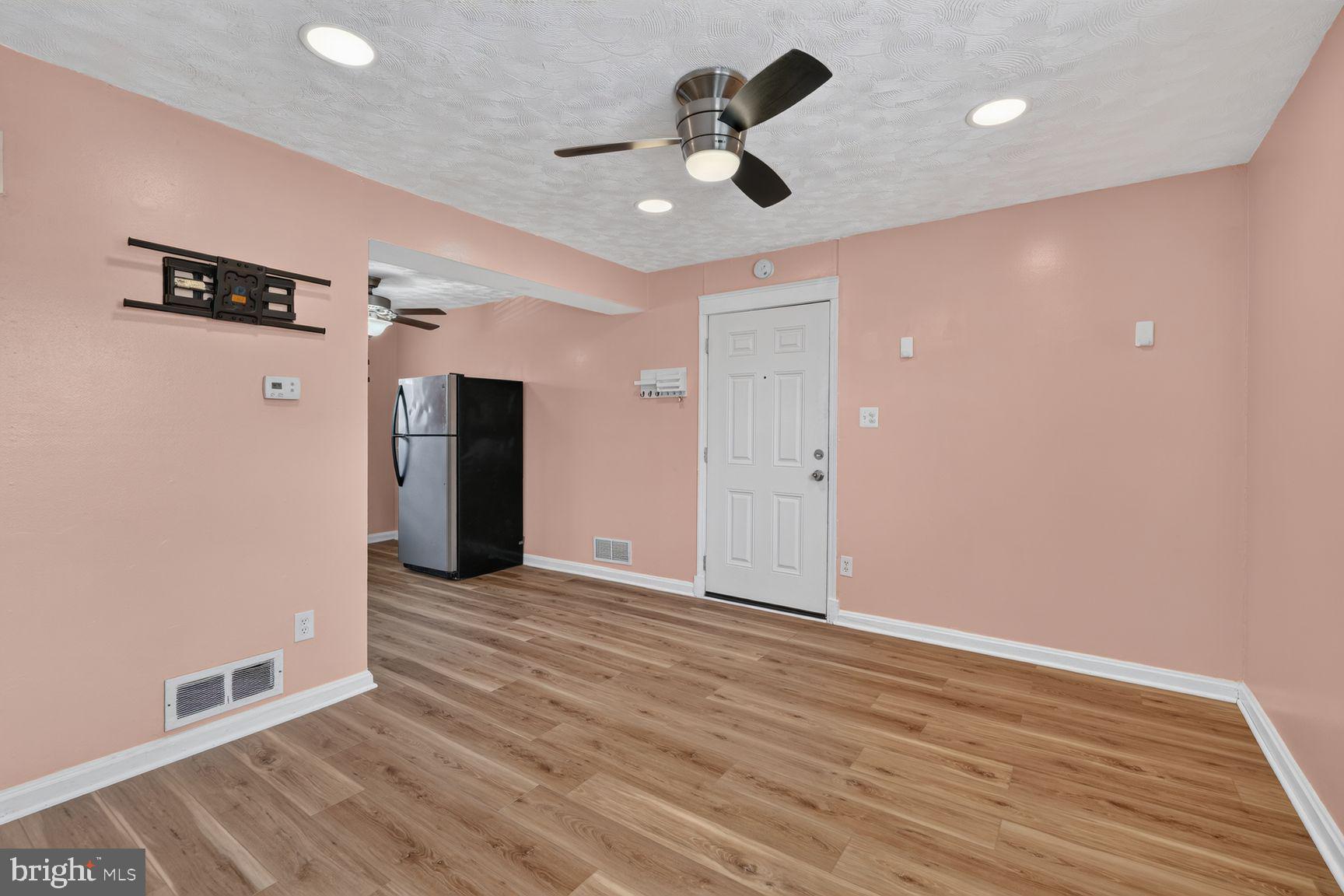 2437 Iverson Street Temple Hills, MD 20748 - Photo 4 of 15 a view of empty room with wooden floor