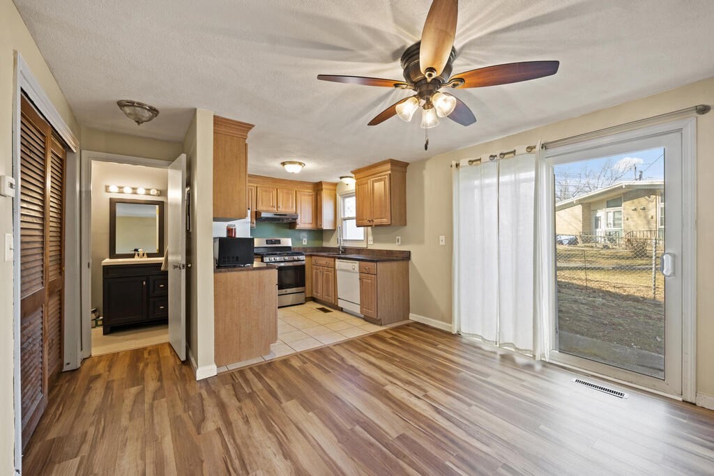 802 Lawrence Street, Unit D Lowell, MA 01852 - Photo 13 of 26 a view of a kitchen with a sink and a refrigerator