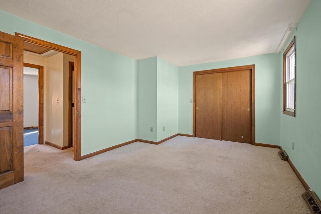 802 Lawrence Street, Unit D Lowell, MA 01852 - Photo 19 of 26 a view of an empty room and a window