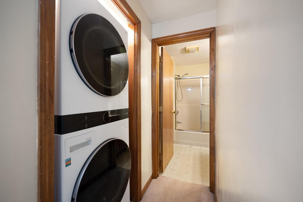 802 Lawrence Street, Unit D Lowell, MA 01852 - Photo 23 of 26 a view of a hallway with washer and dryer