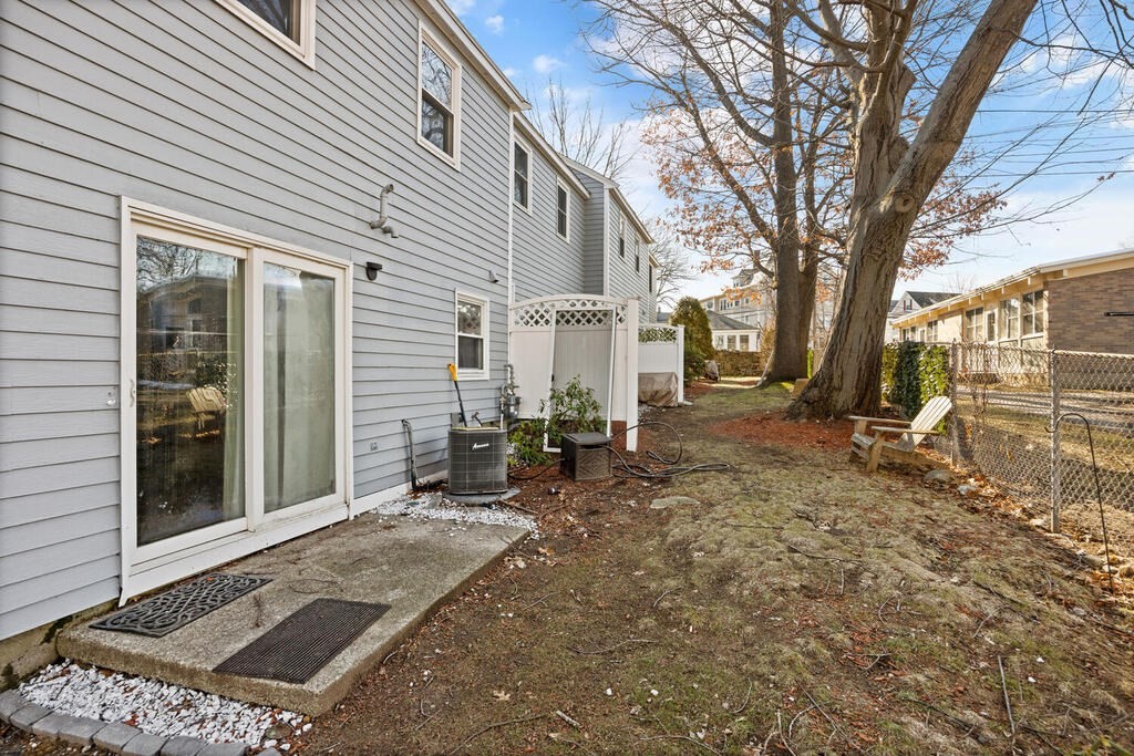 802 Lawrence Street, Unit D Lowell, MA 01852 - Photo 25 of 26 a view of a house with backyard and sitting area