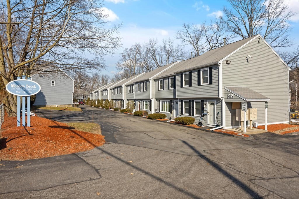 802 Lawrence Street, Unit D Lowell, MA 01852 - Photo 5 of 26 a view of a house with pool and chairs