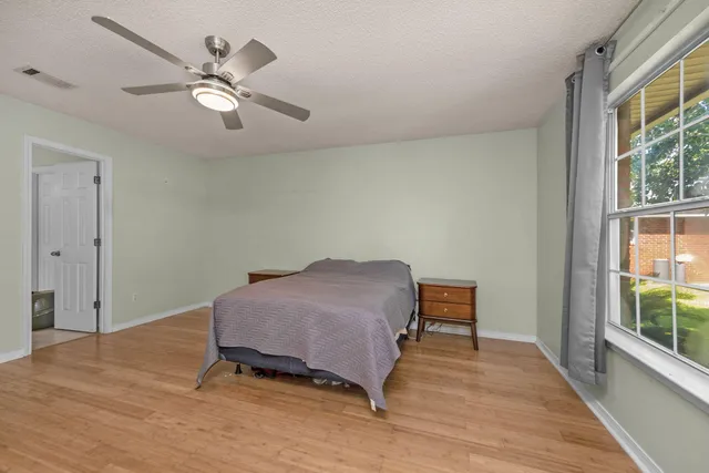 a room with a bed and a window