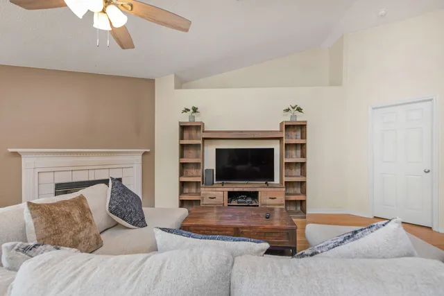 a living room with furniture and a flat screen tv
